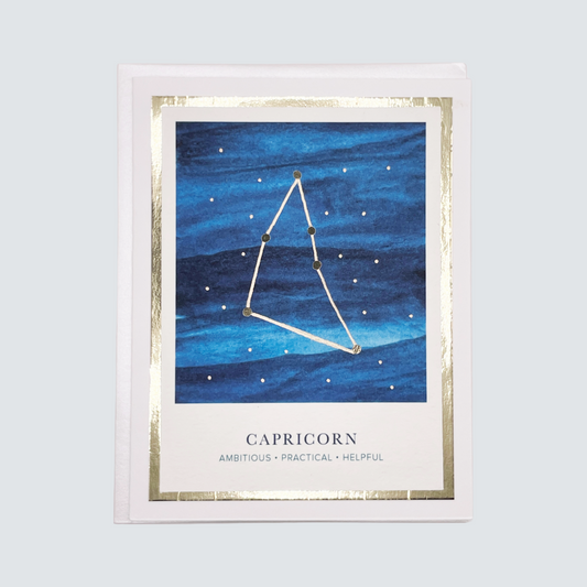 Handmade Capricorn zodiac constellation card with watercolor sky and gold foil accents, blank inside on FSC-certified cardstock.