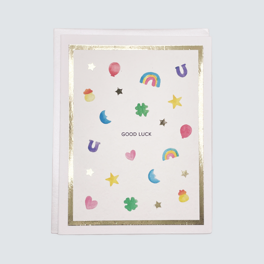 Handmade good luck card with watercolor charms and gold foil border, blank inside on FSC-certified cardstock.