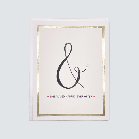 Handmade wedding card with ampersand design, gold foil border, and silver rhinestone accent, blank inside.
