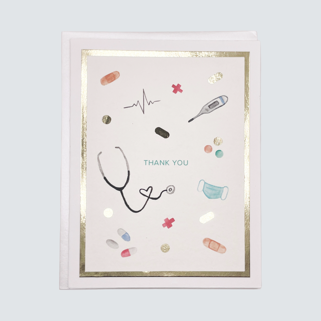 Handmade healthcare thank you card with stethoscope and medical illustrations in gold foil, blank inside on FSC-certified cardstock.