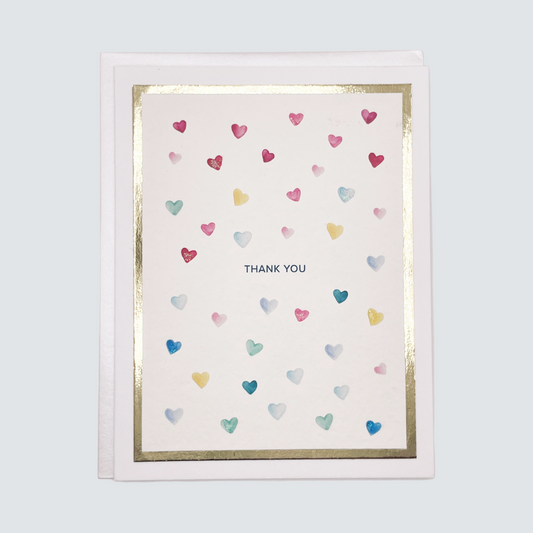 Handmade thank you card with watercolor hearts and gold foil border, blank inside.