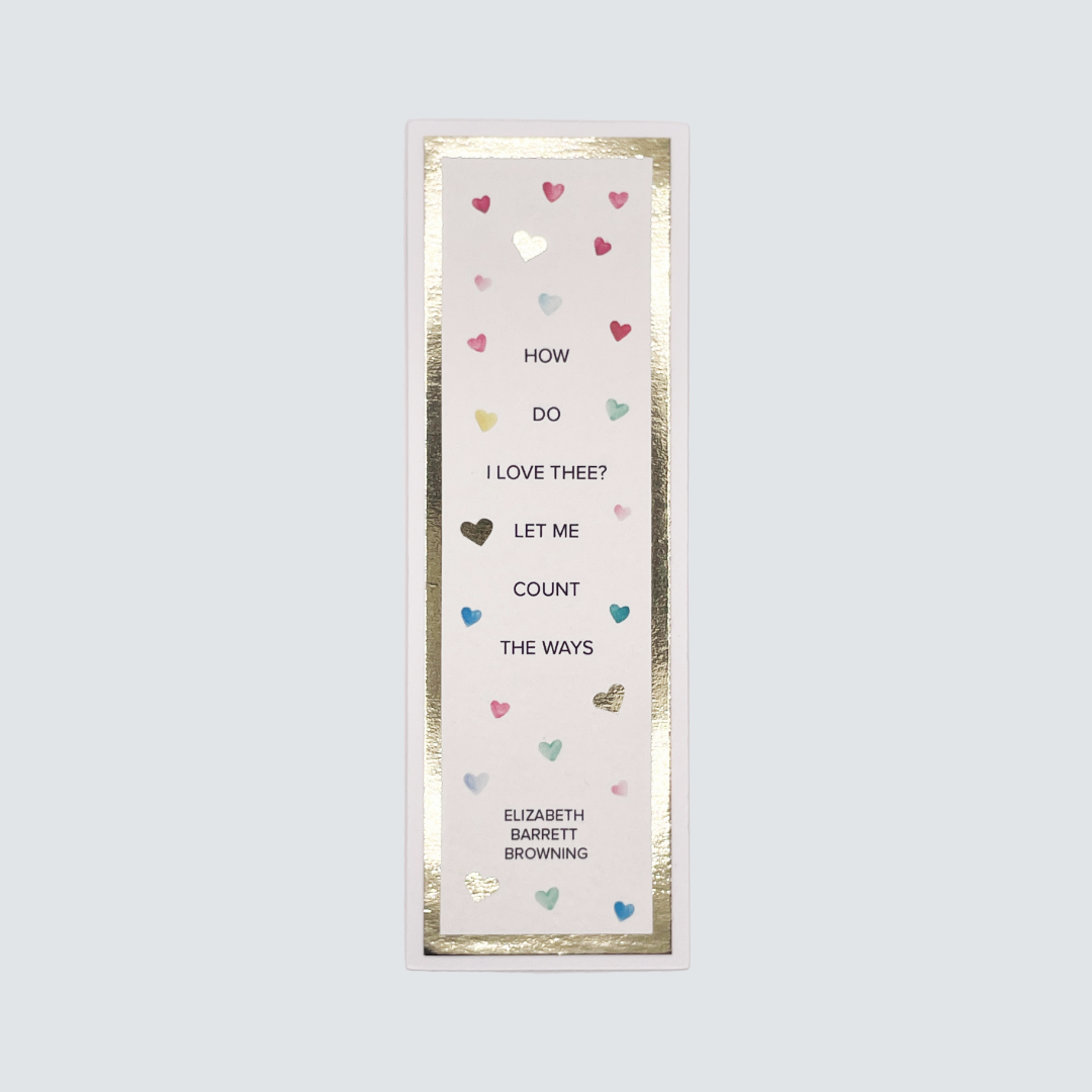A bookmark with a quote 'How Do I Love Thee?' on a white background, embellished with gold foil and heart illustrations.