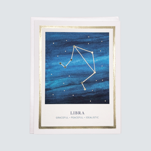 The image features a Libra Zodiac Card with a serene and artistic depiction. The card showcases a giclée print of hand-watercolored artwork, highlighting the Libra constellation against a deep, blue celestial background.