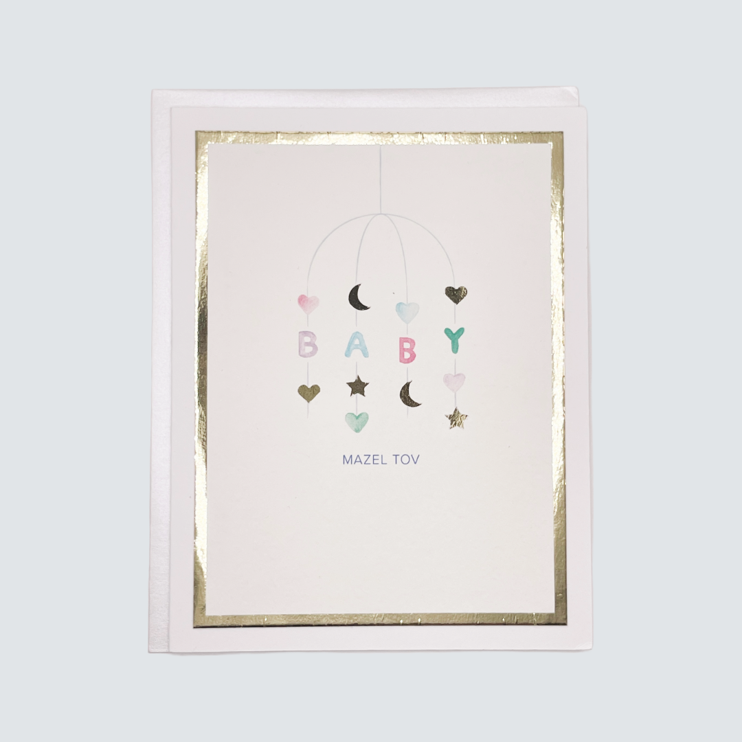 Handmade Mazel Tov baby card with watercolor artwork and gold foil border, blank inside.