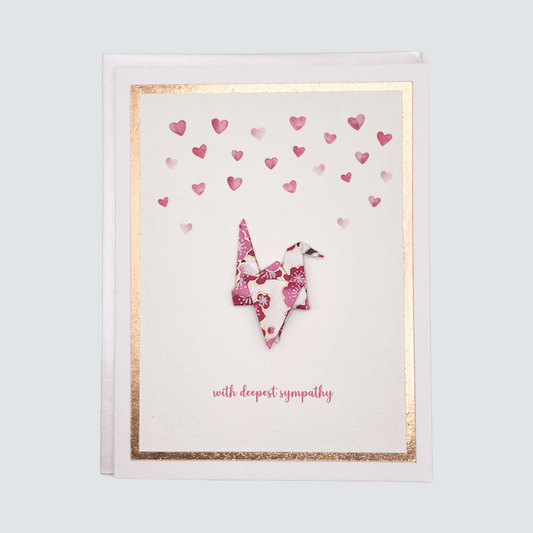 Handmade sympathy card with watercolor origami crane and rose gold foil accents, blank inside.