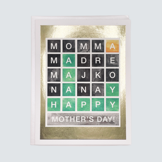 Handmade Wordle-inspired Mother’s Day card with colorful letter tiles and gold foil details, blank inside.