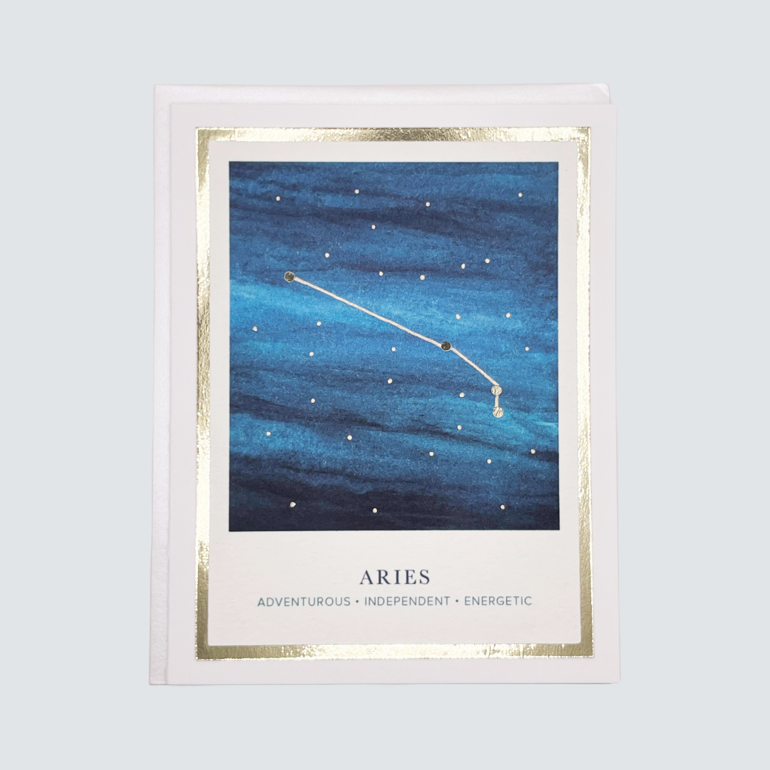 Handmade Aries zodiac constellation card with watercolor night sky and gold foil details, blank inside.
