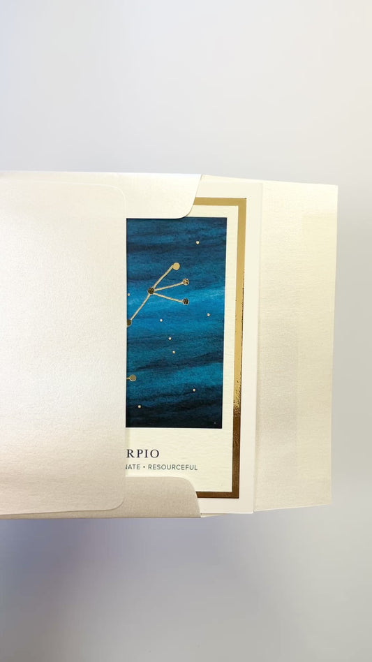 Handmade Scorpio zodiac constellation card with watercolor starry sky and gold foil embellishments, blank inside on FSC-certified cardstock.