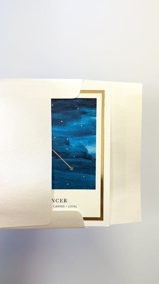 Handmade Cancer zodiac constellation card with watercolor night sky and gold foil details, blank inside on FSC-certified cardstock.