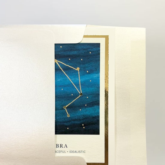 Handmade Libra zodiac constellation card with watercolor night sky and gold foil, blank inside on premium cardstock.