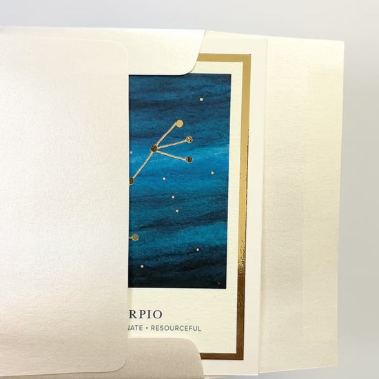 Handmade Scorpio zodiac constellation card with watercolor starry sky and gold foil embellishments, blank inside on FSC-certified cardstock.